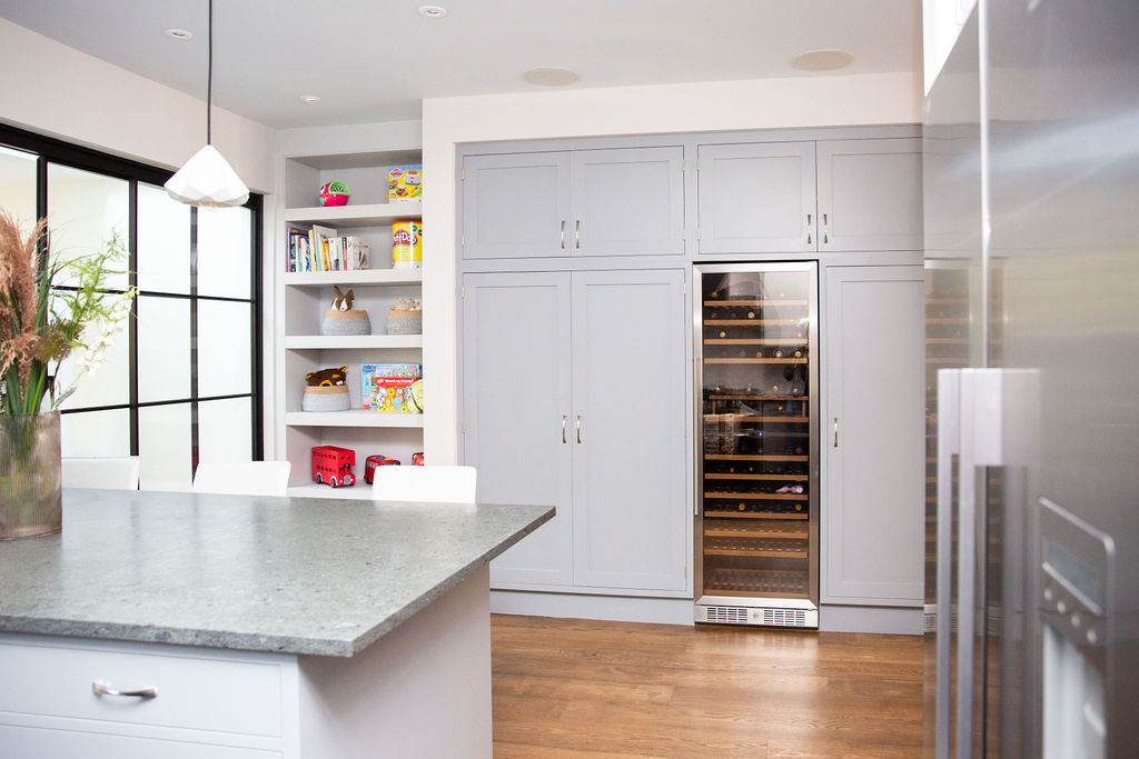 kitchen with shelfs, cupboards and wine fridge