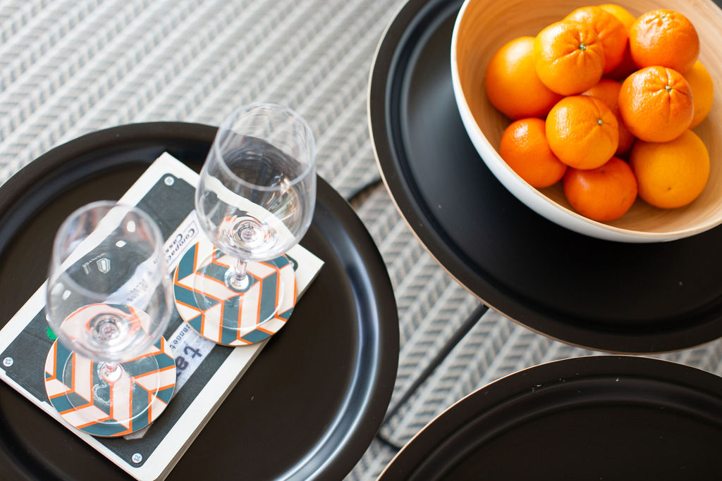 coffee table with champaign glasses and bowl of tangerines