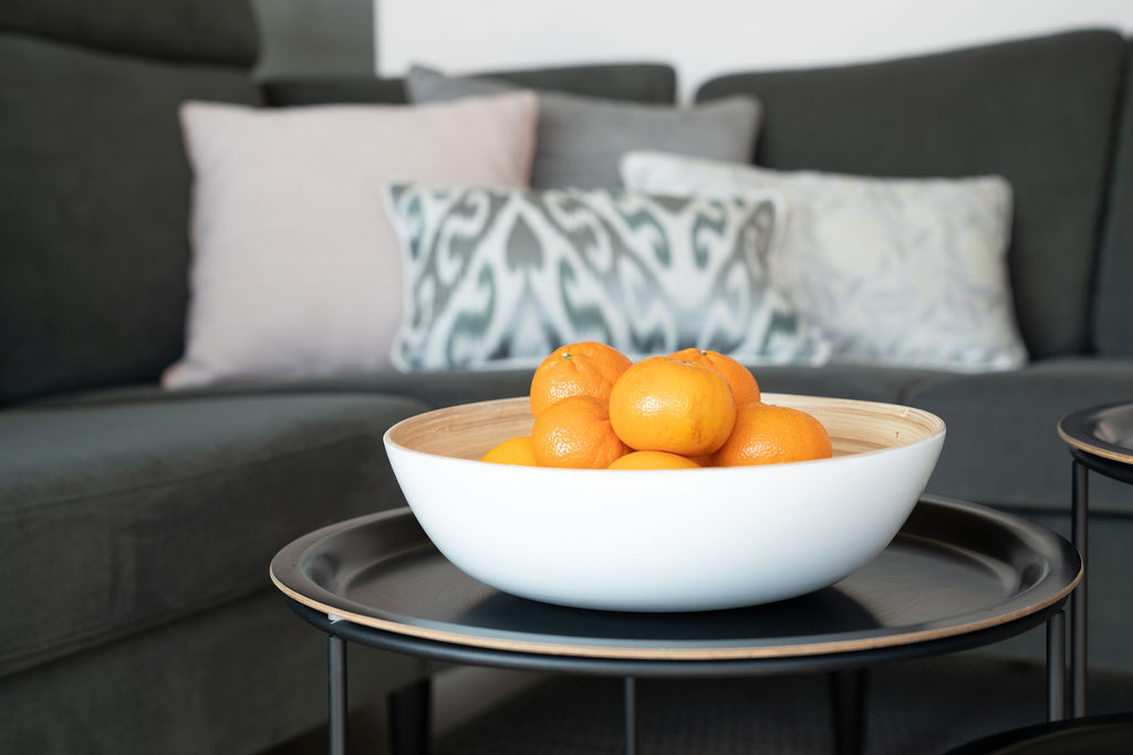 bowl of tangerines on coffee table