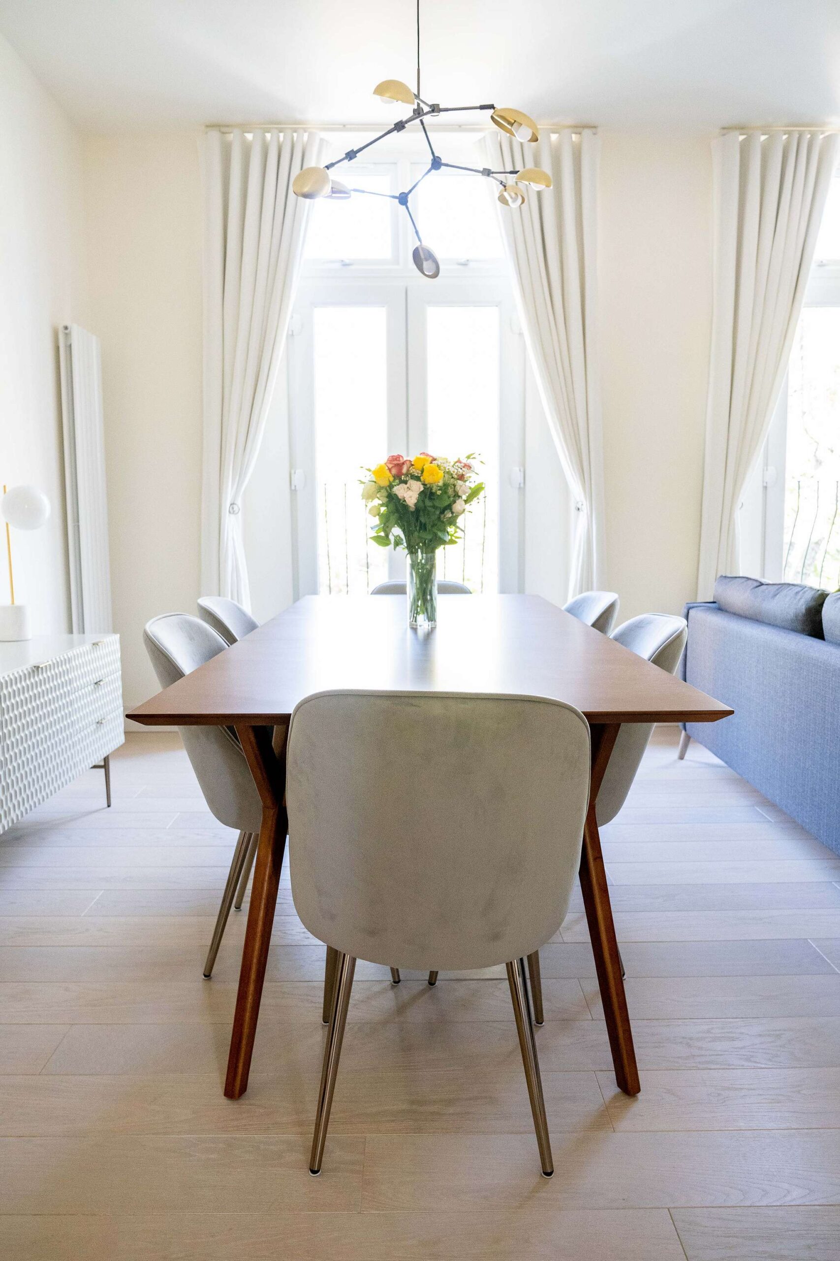 dining table with chairs, flower and light fitting