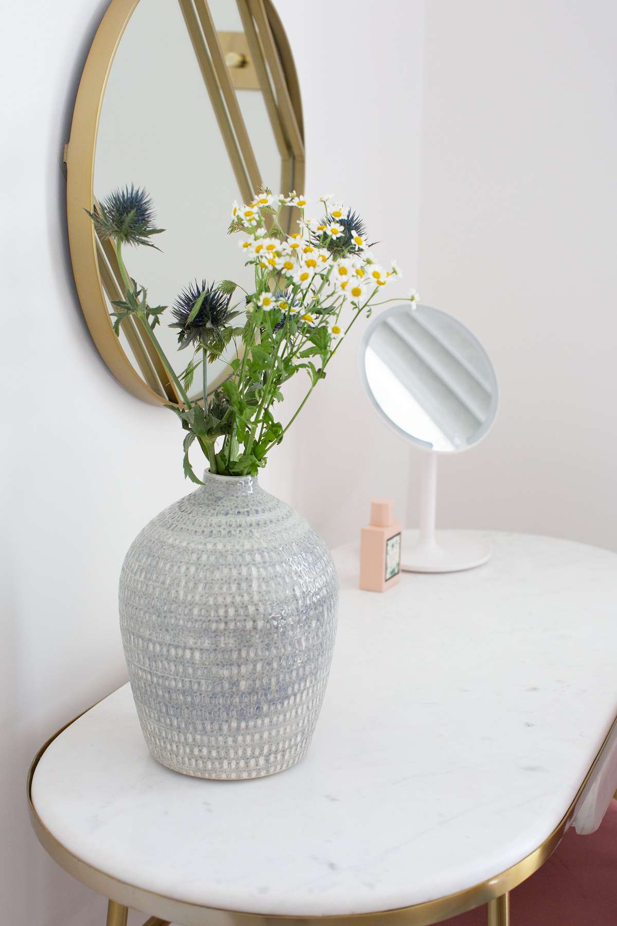 make-up desk with vase of flowers