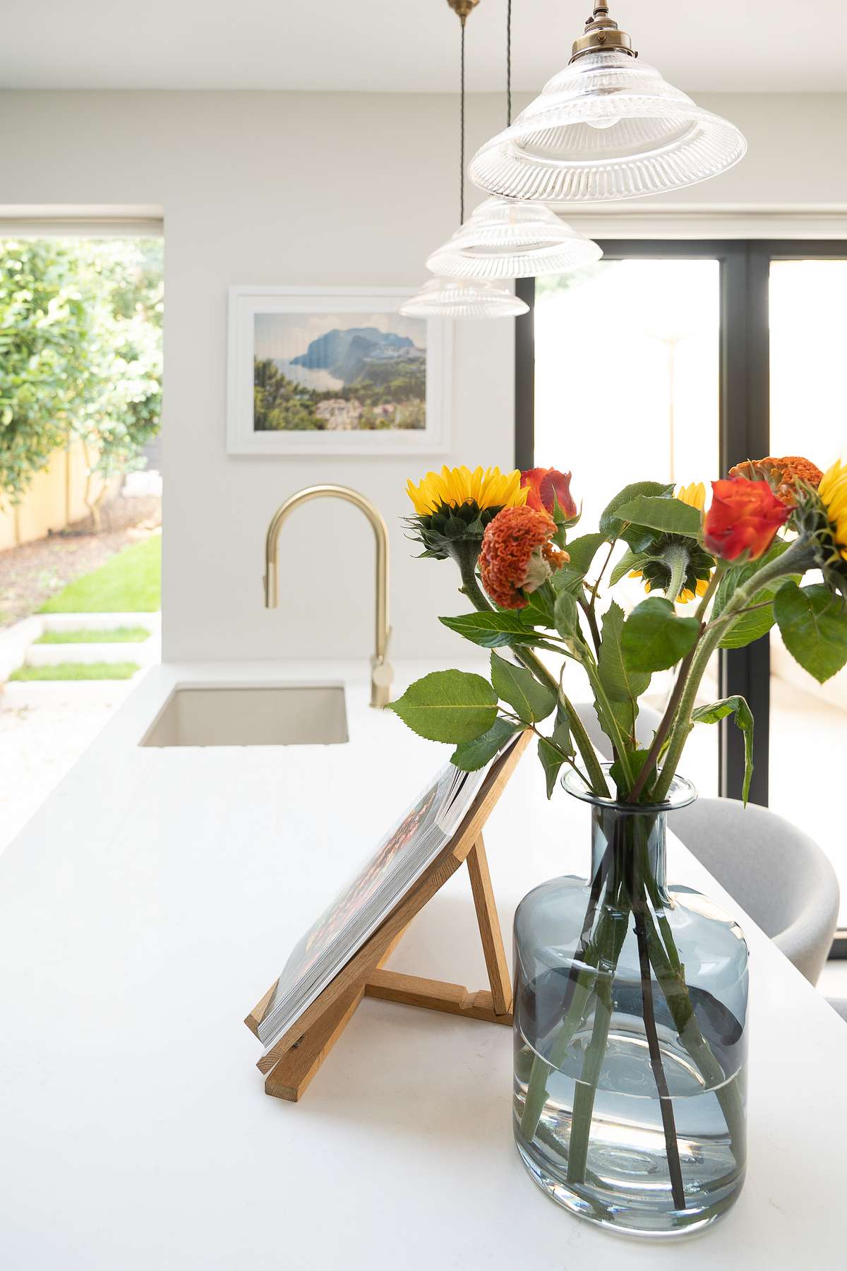kitchen worktop surface with flowers in a vase