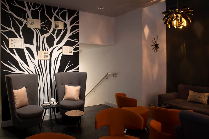 lounge with chairs and wall art