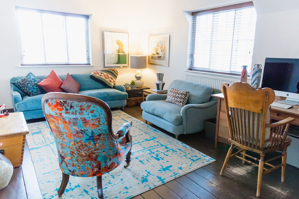 living area with chairs and sofas